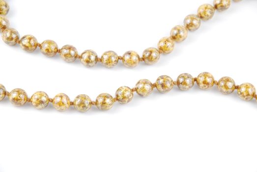 close-up on pearl necklace isolated on a white background
