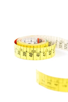 colorful measuring tape isolated on white background (shallow depth of field)
