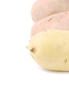 bunch of potatoes isolated on white background (shallow depth of field)