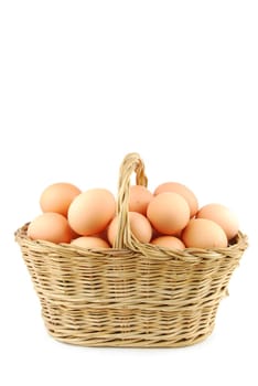 eggs in a traditional wicker basket isolated on white background