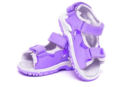 Purple child's sandals isolated on white