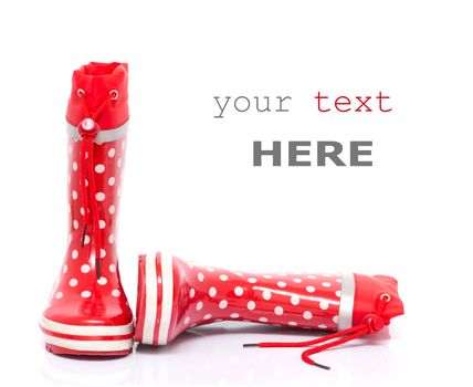 Red rubber boots for kids isolated on white background (with space for text)