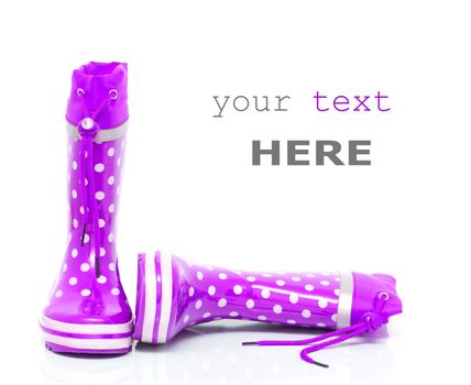 Purple rubber boots for kids isolated on white background (with space for text)