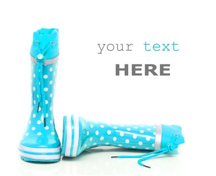 Cyan rubber boots for kids isolated on white background (with space for text)