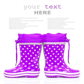 Purple rubber boots for kids isolated on white background (with sample text)