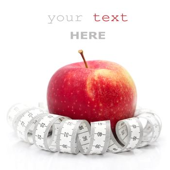 Red apple and tape measure isolated on white (with sample text)