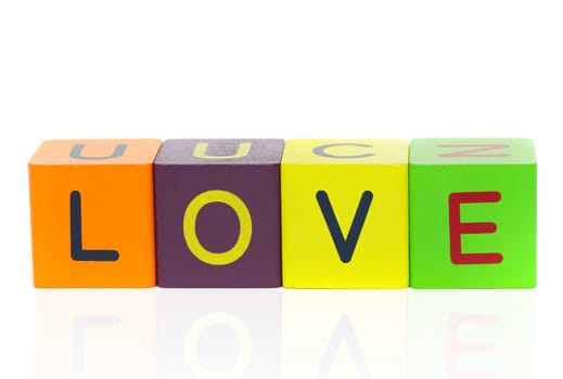 Love  - word formed with alphabet blocks isolated on a white background