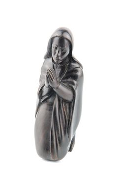 religious blackwood figurine of Virgin Mary isolated on white background