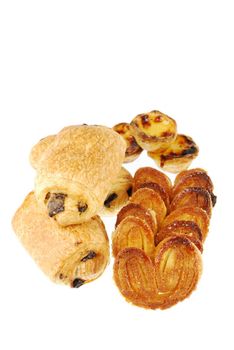 nice assortment of pastries (pastel de nata, pain au chocolat and palmier) isolated on white background