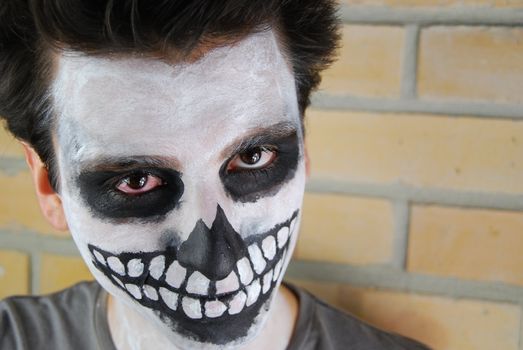 portrait of a creepy skeleton guy perfect for Carnival (brick wall background)
