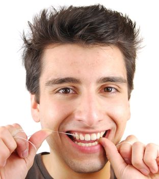 young man flossing his teeth isolated on white background