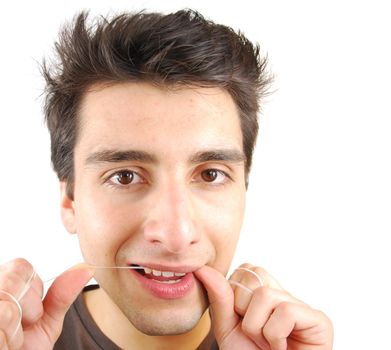 young man flossing his teeth isolated on white background