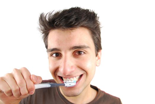 cheerful young man is washing teeth over white background
