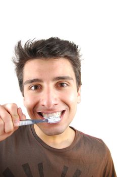 cheerful young man is washing teeth over white background
