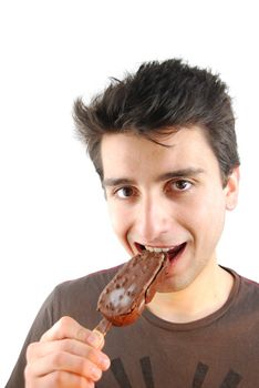 handsome young man eating a chocolate ice-cream isolated on white background