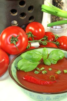 Tomato soup with basil and fresh vegetables