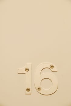 white flat number hanging on the door