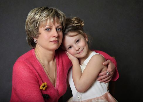 Portrait mum with a daughter in studio