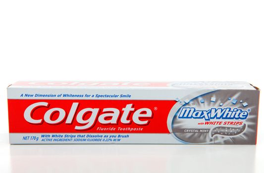 Colgate brand Max White toothpaste with whitening strips for whiter teeth.  White background.  Editorial Use Only.
