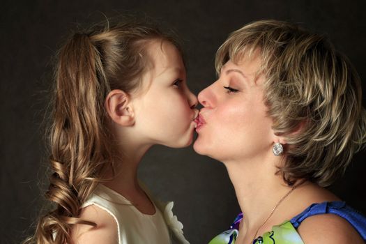 Portrait mum with a daughter in studio