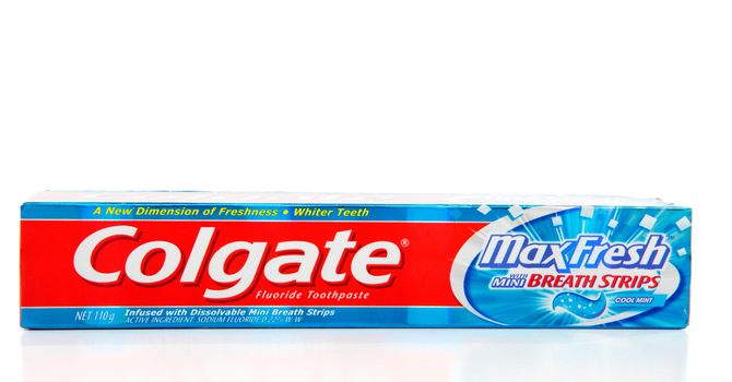 Colgate Max Fresh toothpaste with contains fluoride and breath strips that dissolve and freshen breath.  White background.  Editorial use only.