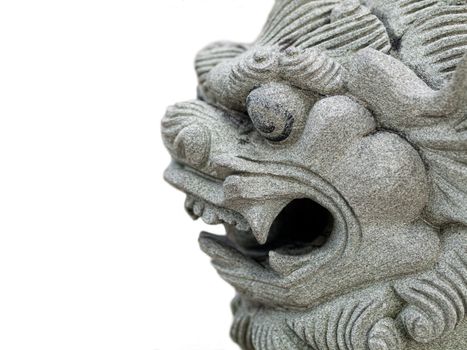 Close up of a dragon head stone statue isolated on white