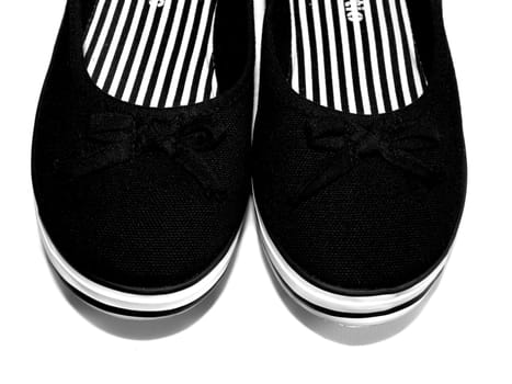 Black and white shoes on the white background.