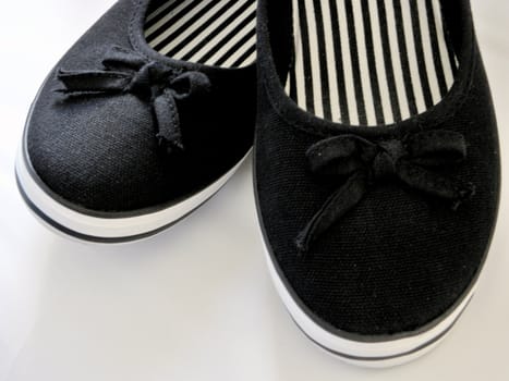 White and black shoes - plimsoll.