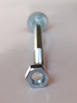 Industrial steel hardware bolt nut screw washer - selective focus