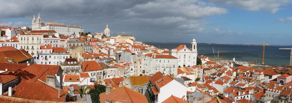 beautiful panoramic view of Lisbon (left to right landmarks: Sao Vicente de Fora church, Pantheon or Santa Engracia church, Santo Estevao church)