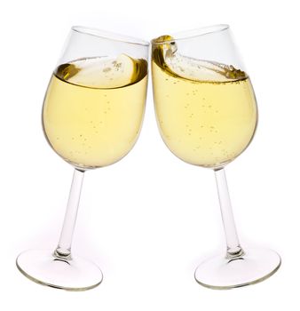 Merry Christmas and happy New year. Pair of champagne flutes making a toast, isolated on white background.