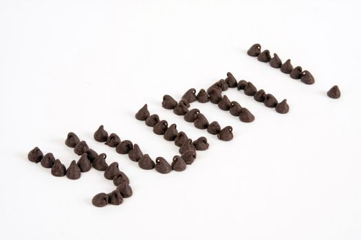 Many chocolate chips spell the word yum.