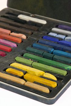 Artistic chalk in its case in color order.