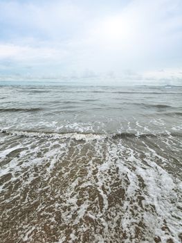 Beach shore wide angle view with bright sun