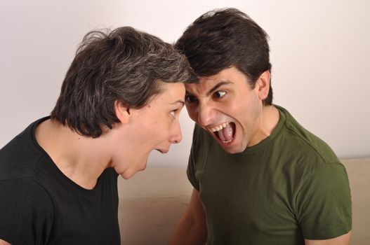 portrait of a woman and man yelling at each other