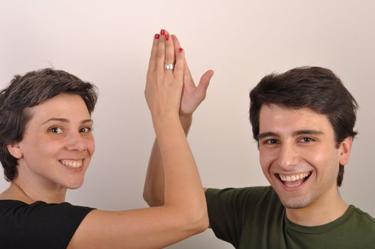 happiness between sister and brother giving each other high five