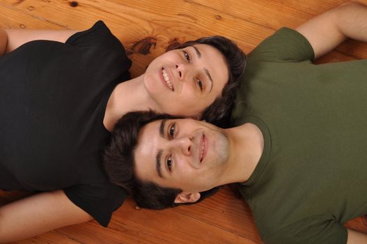 lovely friendship between sister and brother lying and relaxing on the floor