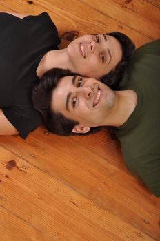 lovely friendship between sister and brother lying and relaxing on the floor