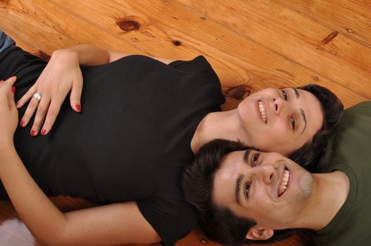 lovely friendship between sister and brother lying and relaxing on the floor