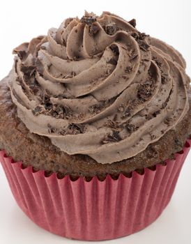 Close-up of chocolate cupcake with chocolate icing and grated chocolate