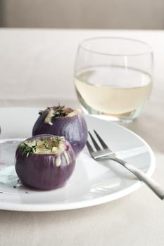 Fresh boiled and stuffed with rice and cheese, seen here with fork and white wine.