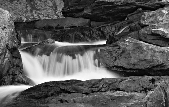 A small waterfall in a stream flowing down rocks