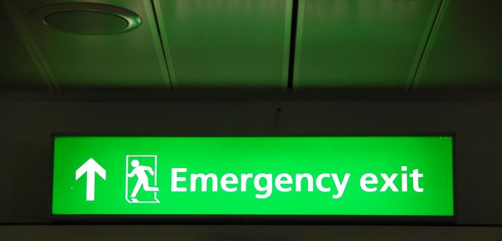 green mergency sign at a international airport