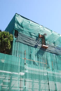 residential building under construction (blue sky background)