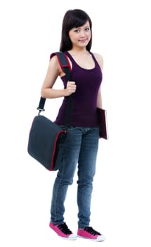 Portrait of a cute young female student holding her book and bag over white background.