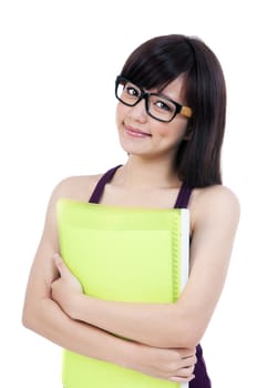 Portrait of a young Asian woman in eyeglasses hugging her folder over white background