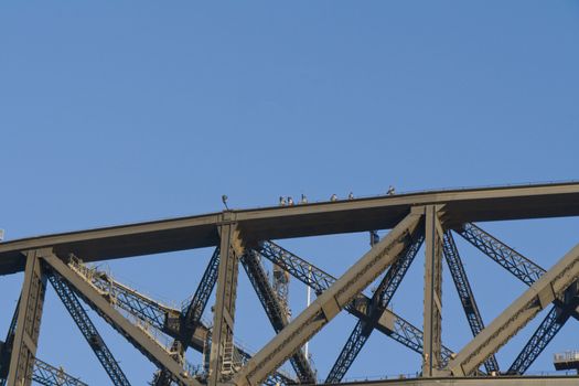 The builders are during reconstruction on the top of the bridge