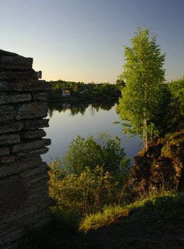 View on the river Volkhov. In the summer, early in the morning, a view on the river Volkhov from coast at an old fortress.