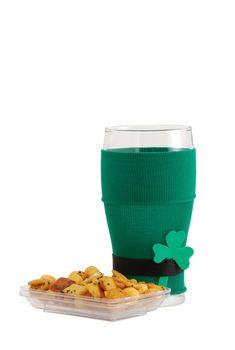 Beer snack and empty beer glass in green with black belt leprechaun suit for St Patrick day celebration decorated with shamrock 