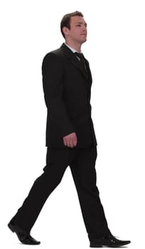 Image of a young businessman walking, isolated against a white background.